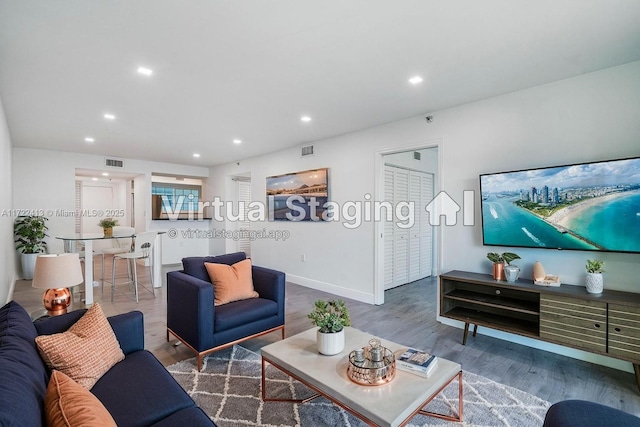 living room with dark hardwood / wood-style flooring