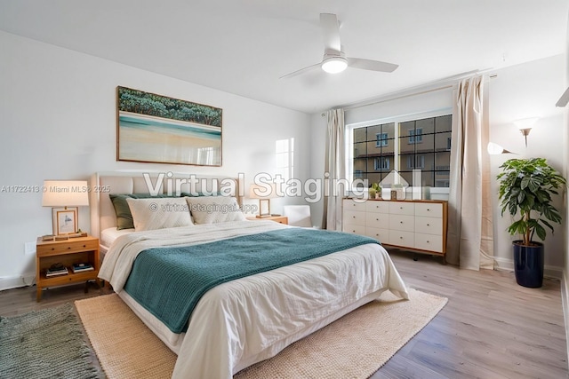 bedroom featuring ceiling fan and wood-type flooring