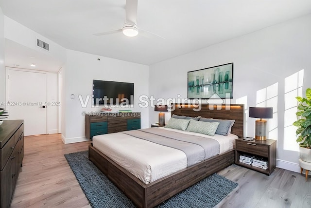 bedroom with ceiling fan and light wood-type flooring