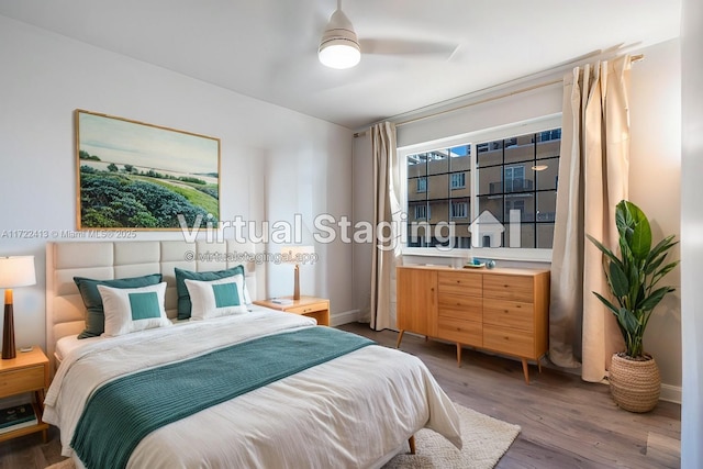 bedroom featuring ceiling fan and dark wood-type flooring