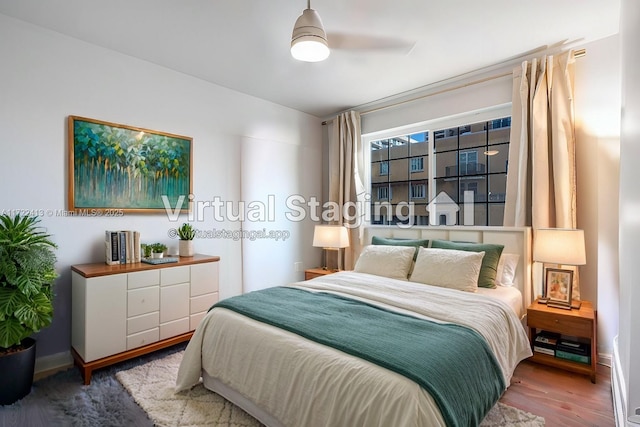 bedroom featuring ceiling fan and wood-type flooring