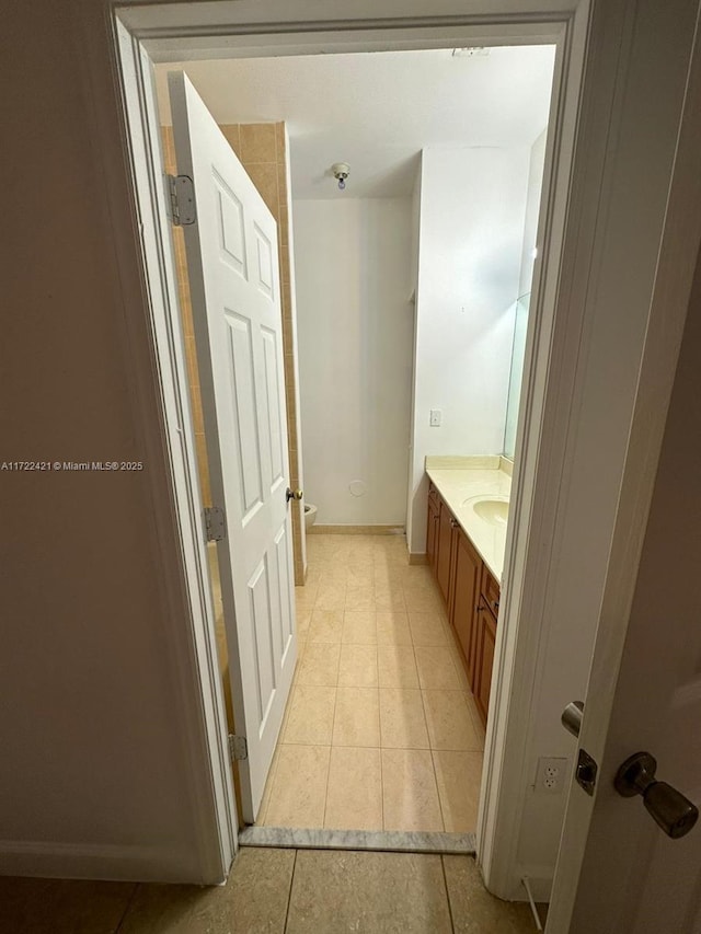 bathroom featuring tile patterned flooring and vanity