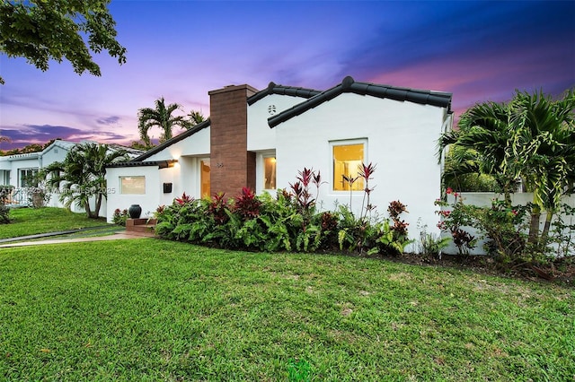 view of front of house with a lawn