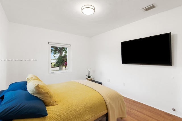 bedroom featuring wood-type flooring