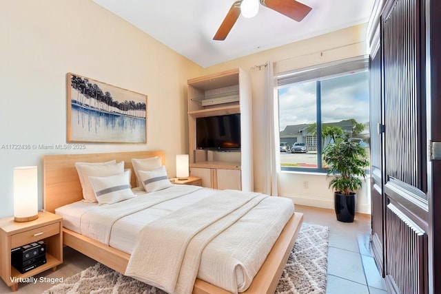 bedroom featuring tile patterned flooring and ceiling fan