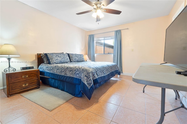 bedroom with ceiling fan and light tile patterned flooring