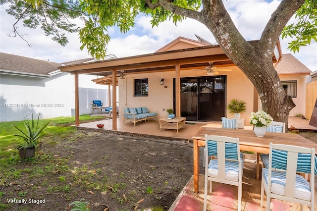 back of house featuring a patio area, ceiling fan, and outdoor lounge area