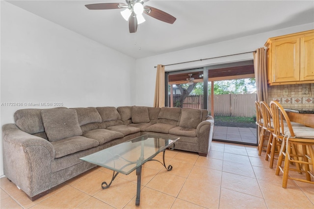 living room featuring ceiling fan and light tile patterned floors