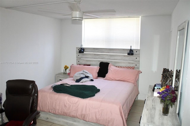 bedroom with light tile patterned floors and ceiling fan