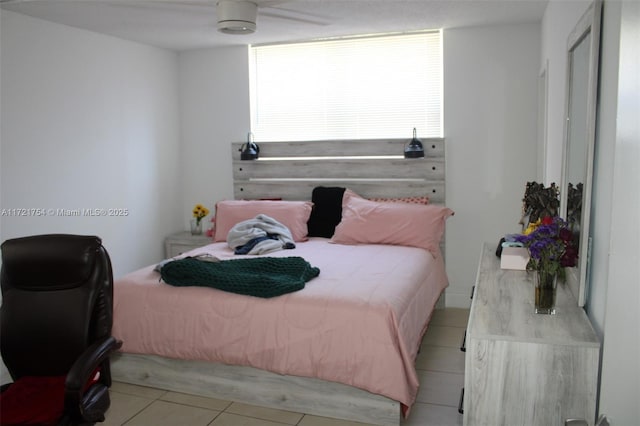 bedroom featuring ceiling fan and light tile patterned floors