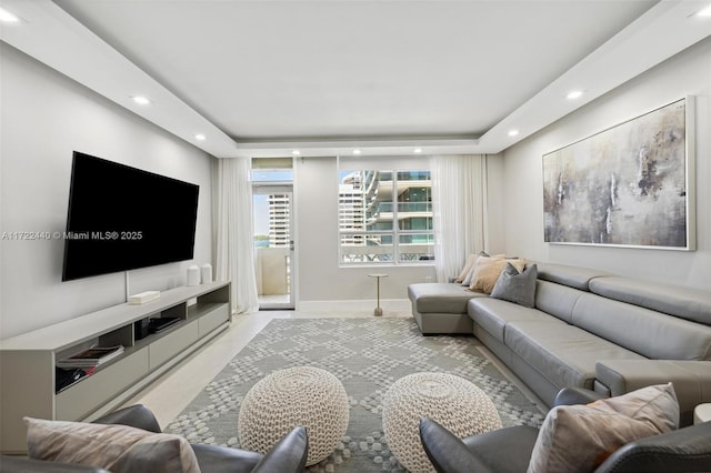 living room featuring a raised ceiling