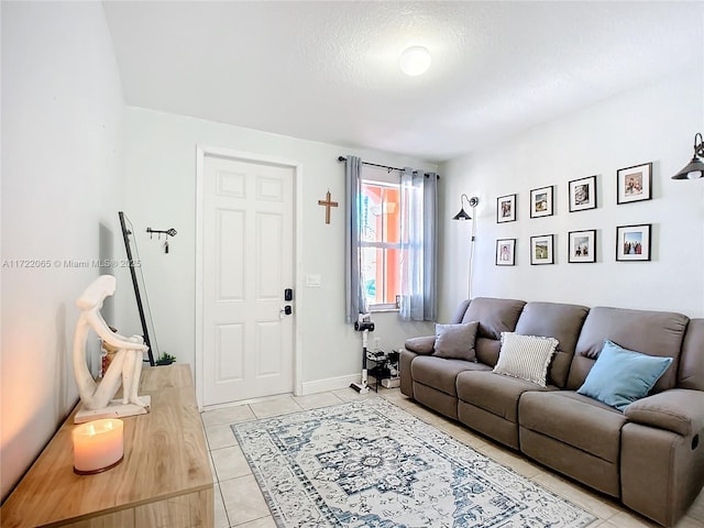 living room featuring a textured ceiling and light tile patterned floors