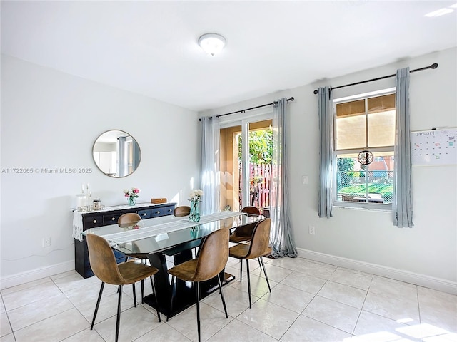 dining space with light tile patterned flooring