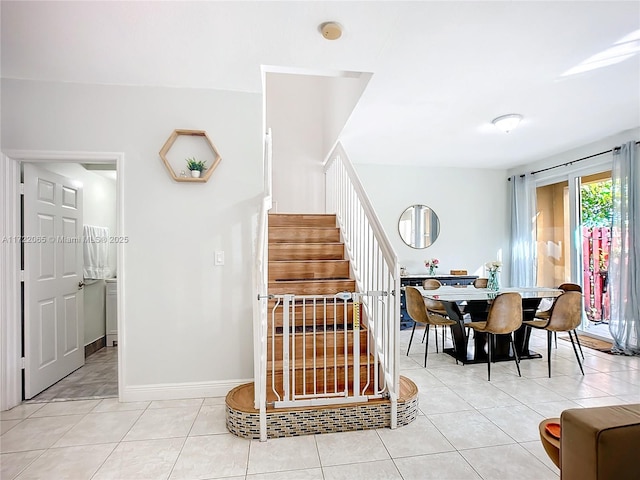 stairs with tile patterned floors