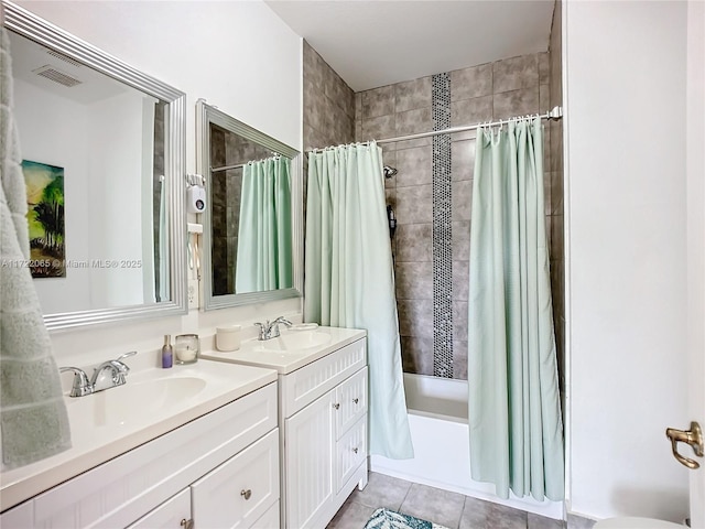 bathroom featuring vanity, shower / bathtub combination with curtain, and tile patterned flooring