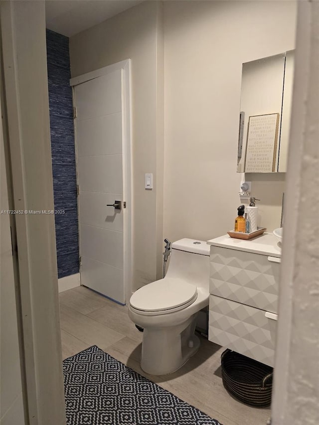 bathroom with vanity and toilet