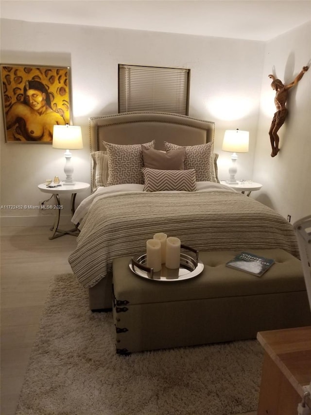 bedroom featuring hardwood / wood-style flooring