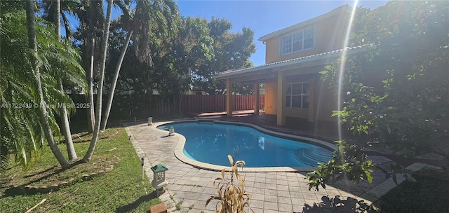 view of swimming pool with a patio