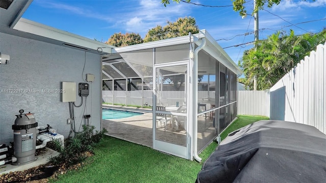 exterior space with a patio area, a fenced in pool, and a yard