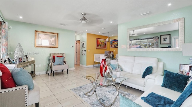 tiled living room with ceiling fan