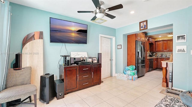 living room with light tile patterned floors and ceiling fan