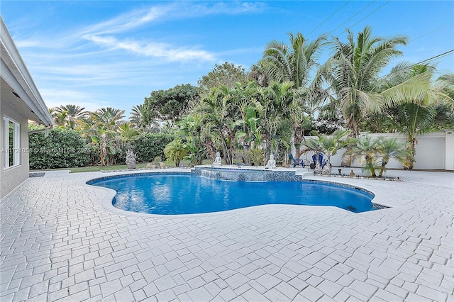 view of swimming pool with a patio area