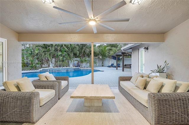 view of swimming pool with an outdoor living space and a patio