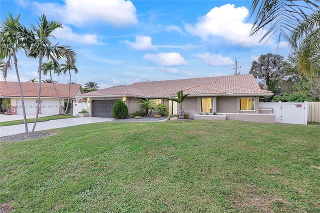 single story home with a front yard and a garage