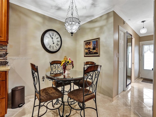 dining space with light tile patterned flooring, ornamental molding, and a chandelier