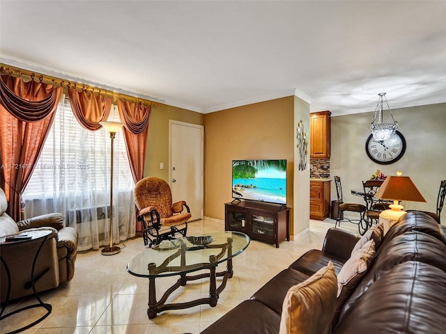 living room featuring ornamental molding and light tile patterned flooring