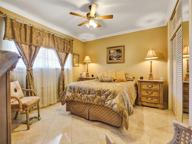 bedroom with light tile patterned floors, ceiling fan, and ornamental molding