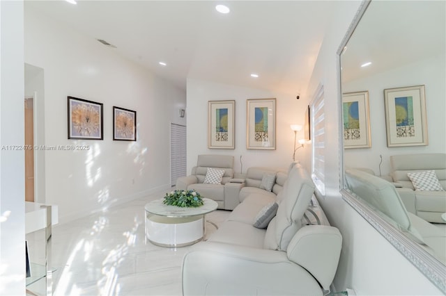 living room featuring lofted ceiling