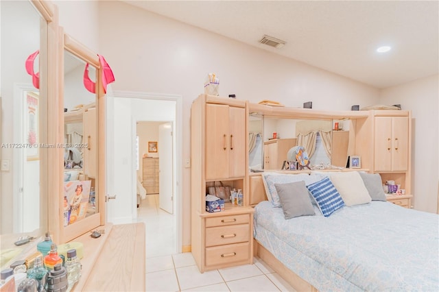 bedroom with light tile patterned flooring