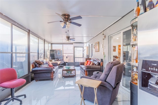 sunroom / solarium featuring ceiling fan