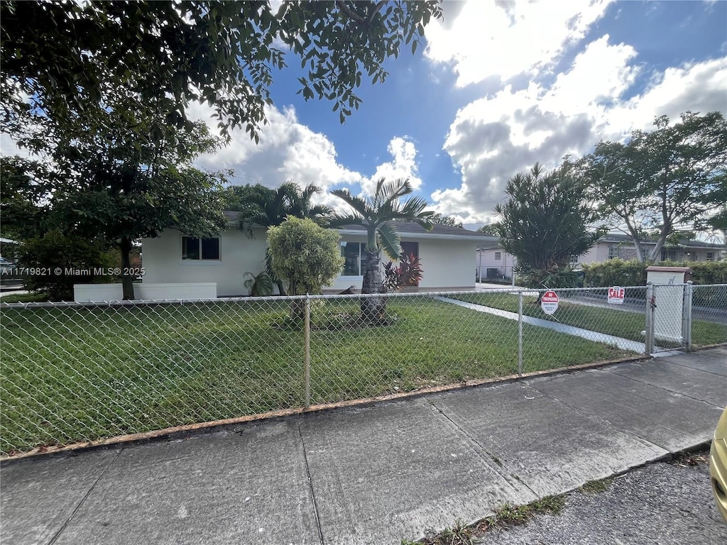 ranch-style house with a front yard