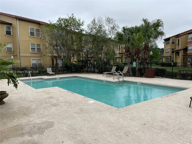 view of swimming pool featuring a patio