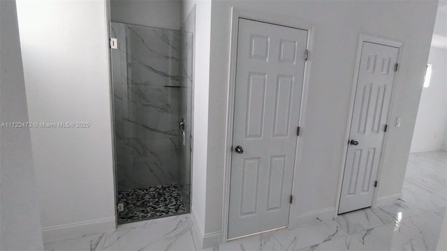 bathroom with a shower with shower door