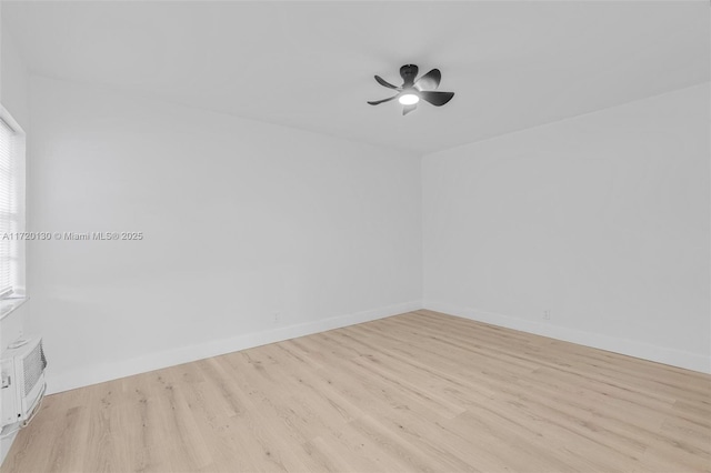 spare room with light hardwood / wood-style flooring and ceiling fan