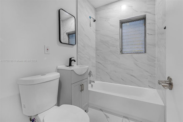 full bathroom with toilet, vanity, and tiled shower / bath combo