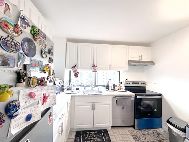 kitchen with sink, white cabinetry, and stainless steel appliances