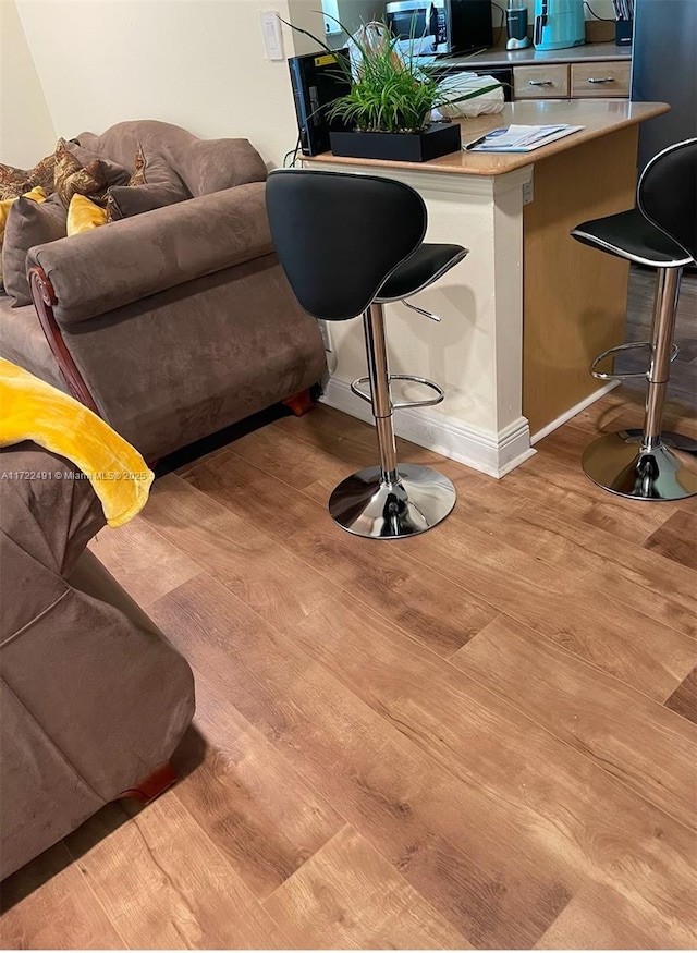 dining space with light hardwood / wood-style flooring