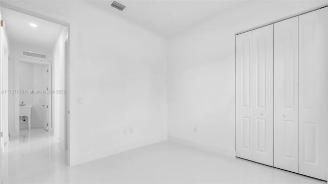 unfurnished bedroom with a closet