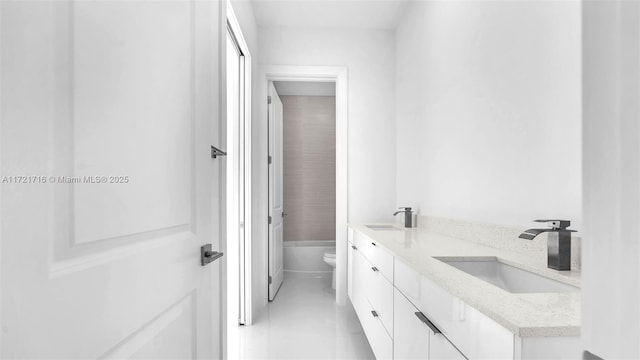 full bathroom featuring tile patterned flooring, vanity,  shower combination, and toilet