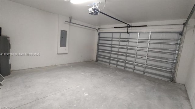 garage with a garage door opener and electric panel