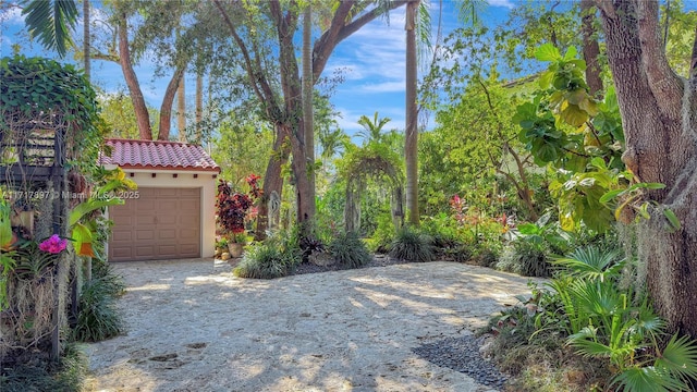 view of yard with a garage