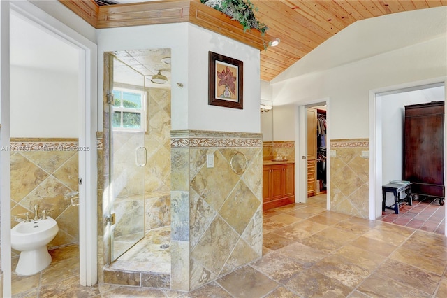 bathroom featuring a bidet, vaulted ceiling, a shower with door, wood ceiling, and tile walls