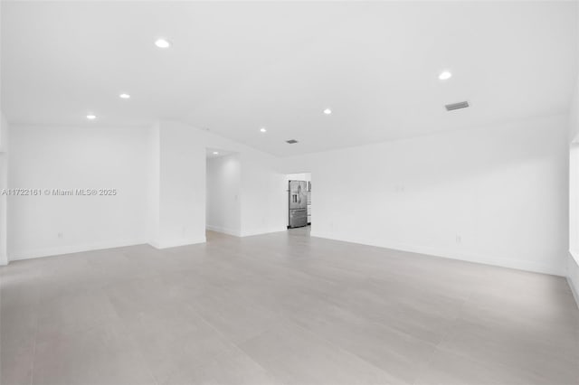 empty room with vaulted ceiling