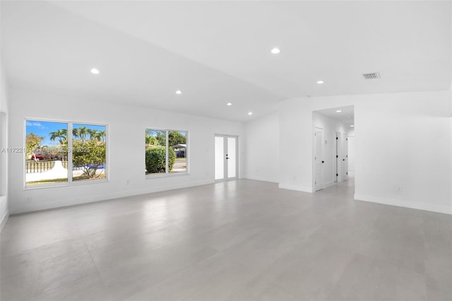 spare room with vaulted ceiling