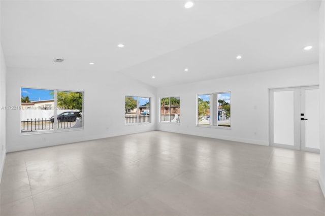 unfurnished living room featuring lofted ceiling