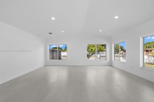 spare room with lofted ceiling